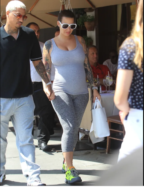 Amber Rose ditches her signature blonde look as she starts growing her hair (Photos)