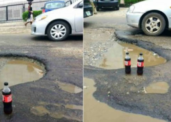 potholes on Lagos road with coke drink