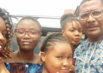 Tony Umez and his daughters