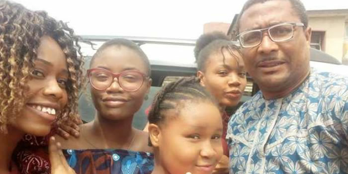 Tony Umez and his daughters
