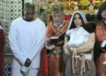 Kanye West, Kim Kardashian, and kid in church