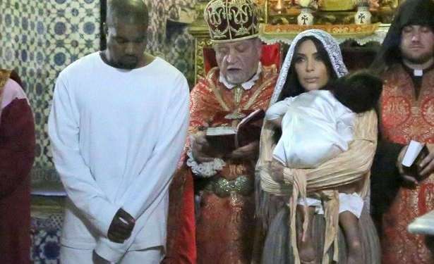 Kanye West, Kim Kardashian, and kid in church