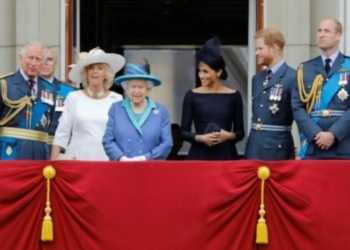 L-R Senior royals including Harry’s father Prince Charles,  Meghan and Harry