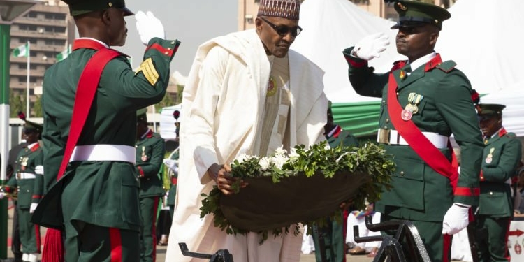 President Muhammadu Buhari Laying the Wreath during the Wreath Laying Ceremony to mark the end of 2020 Armed Forces Remembrance Day Celebrations held at the Eagle Square in Abuja