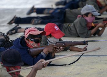 Cross section of Mexican kids taking precision shots