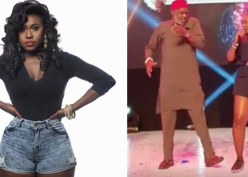 Singer Niniola and a 'Red Cap' Chief dancing on stage