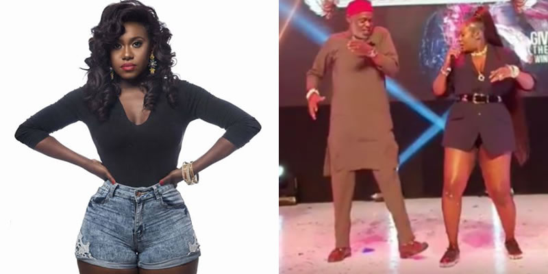 Singer Niniola and a 'Red Cap' Chief dancing on stage