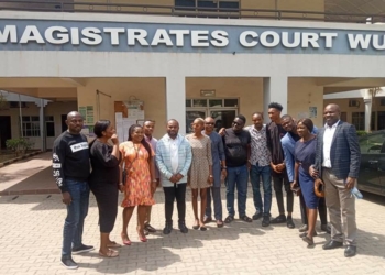 TheNigerian News Group journalists, Pricilla Ajeshola, Jacob Orji, Abayomi Adedoyin, Peggy Shande and David Gold Enemingin with their colleagues in-front of Magistrate court in Abuja after they were granted bail