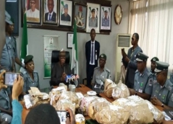 Cross section of Custom officials and recovered $8m fund