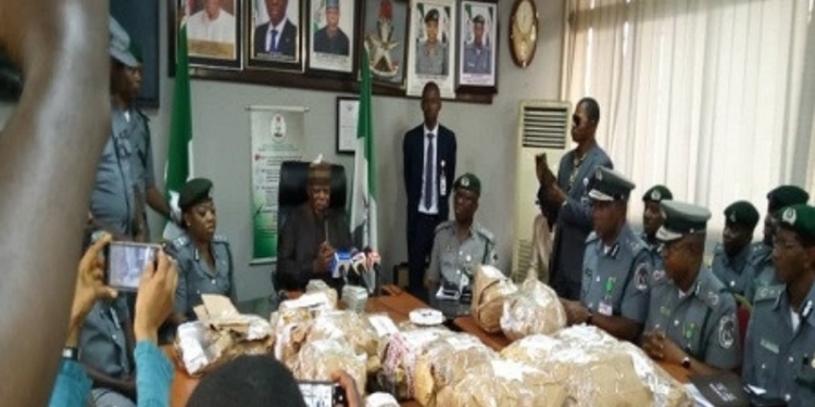 Cross section of Custom officials and recovered $8m fund