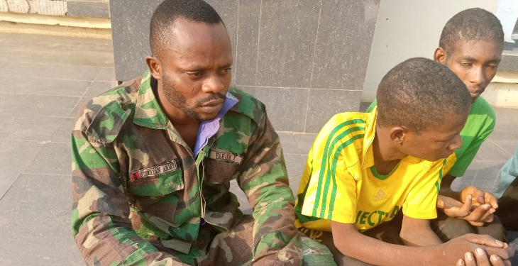 L-R arrested fake soldier and two out of the 11 arrested suspects