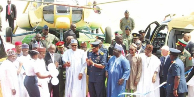 Former Governor of Sokoto State, Aliyu Magatakarda Wamakko (left); Minister of Defence, Maj.-Gen. Bashir Magashi (rtd.); Speaker, House of Representatives, Femi Gbajabiamila; President Mohammadu Buhari; Chief of the Air Staff, Air Marshal Sadique Abubakar; representative Kebbi South Senatorial District, Bala Na’Allah; Minister of Interior, Rauf Aregbesola and his Information and Culture counterpart, Lai Muhammed at the induction ceremony of Nigeria Air Force Combat Helicopters in Abuja on Thursday