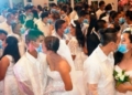 Filipino couples kiss each other while wearing masks provided by the City Health Office in Bacolod (Picture: Bacolod City Public Information Office)