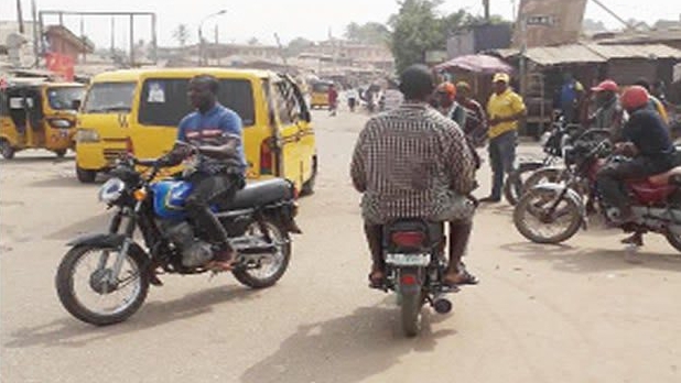 Depict of a junction where motorcycles are parked