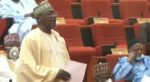 Moment a Nigerian Senator removed his face mask to sneeze during plenary