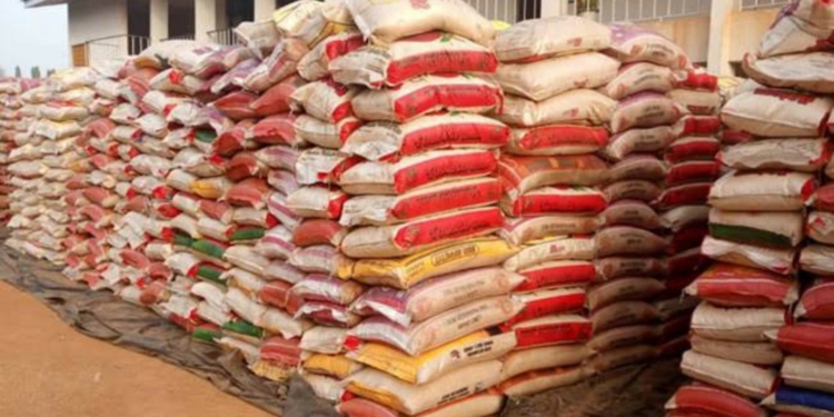 President Buhari orders distribution of 150 trucks of seized rice to Nigerians