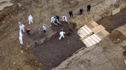 COVID-19: Hundreds of bodies buried in mass grave on island in New York