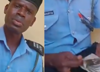 VIDEO: Police officer caught on video counting money after "extorting" 40,000 from a man has been arrested