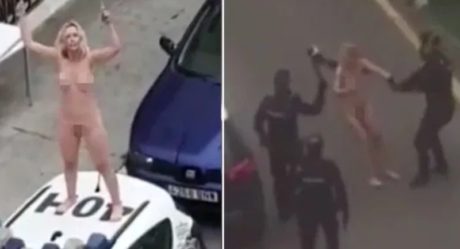 Woman strips naked and jumps on police car after leaving court for breaching lockdown order