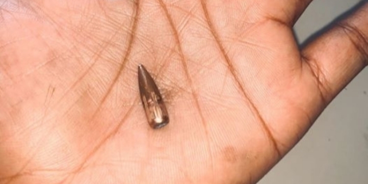 PHOTOS: Nigerian lady and her children escape death as stray bullet pierces through her wall