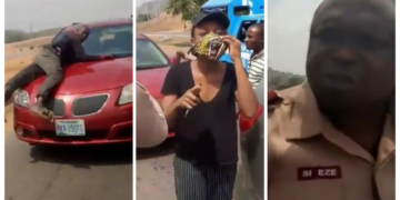 VIDEO: Policeman spotted on bonnet of speeding vehicle of a lady who refused to stop for security operatives