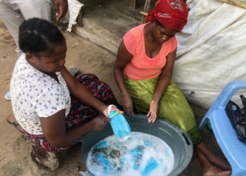 Photos: Mozambican women caught washing used facemasks to resell