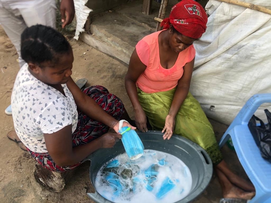 Photos: Mozambican women caught washing used facemasks to resell