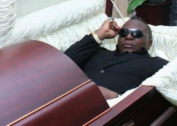 Charly Boy reveals why he is not scared of death as he lays in a coffin in new photos