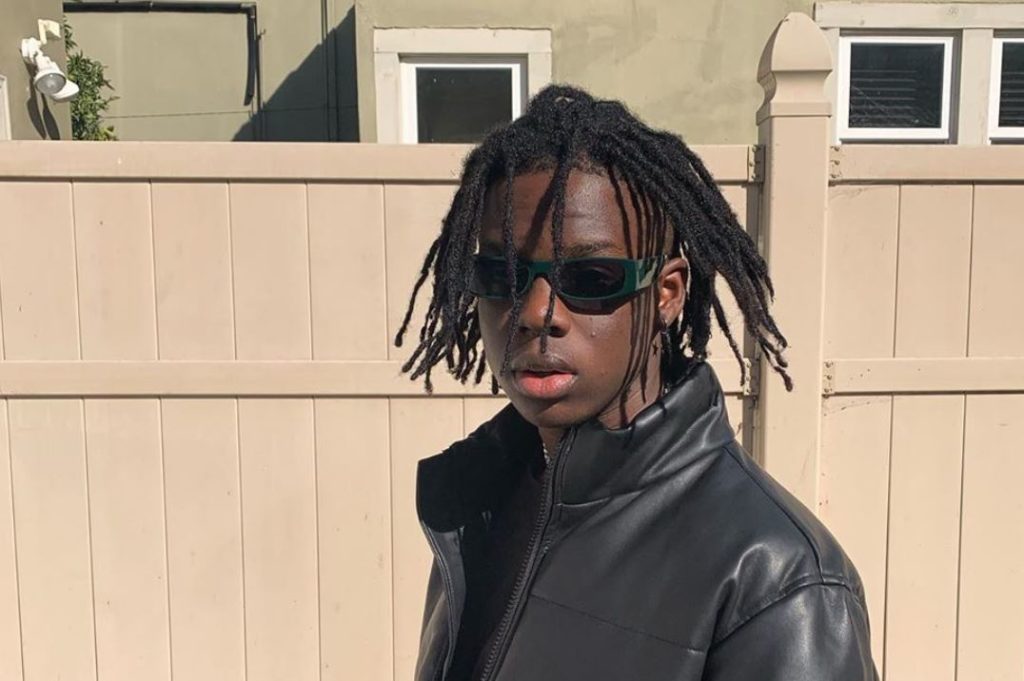 Rema celebrates as Apple Music puts his face on a billboard