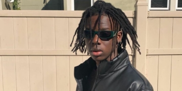 Rema celebrates as Apple Music puts his face on a billboard