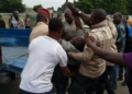 PHOTOS: Angry mob pounce on FRSC official in Delta for allegedly pushing driver off his