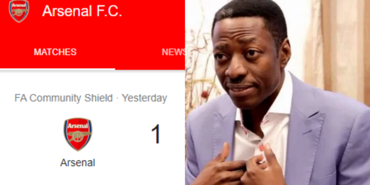 Pastor Sam Adeyemi celebrates with Arsenal fans after club beats Liverpool