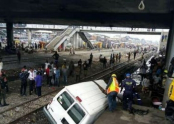 Passengers narrowly escape death as bus collides with moving train in Lagos