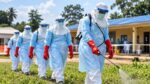 Healthcare workers in protective equipment during an Ebola disease response