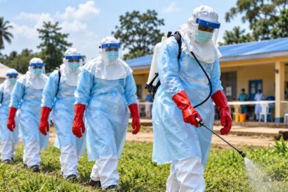 Healthcare workers in protective equipment during an Ebola disease response
