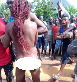 Married woman caught pants down with her ex, who is also married, are paraded naked and beaten in Enugu (photos)