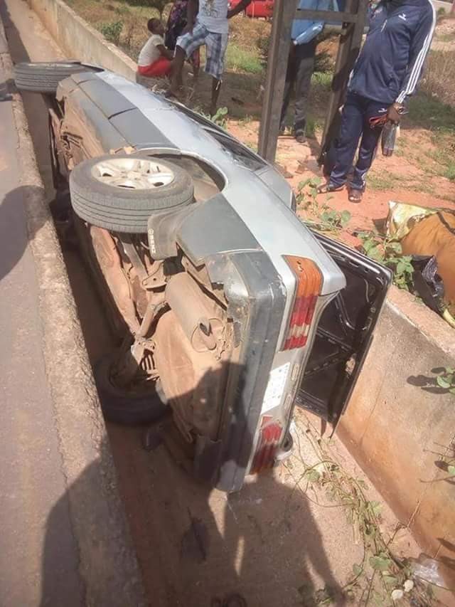 Mother and daughter miraculously survive crash as car somersaults, plunges into drainage in Anambra