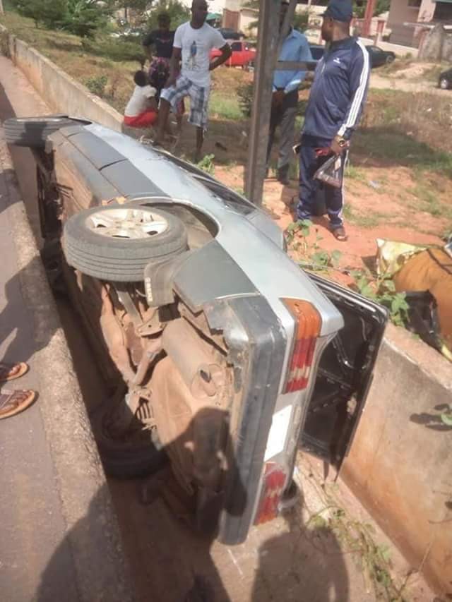 Mother and daughter miraculously survive crash as car somersaults, plunges into drainage in Anambra