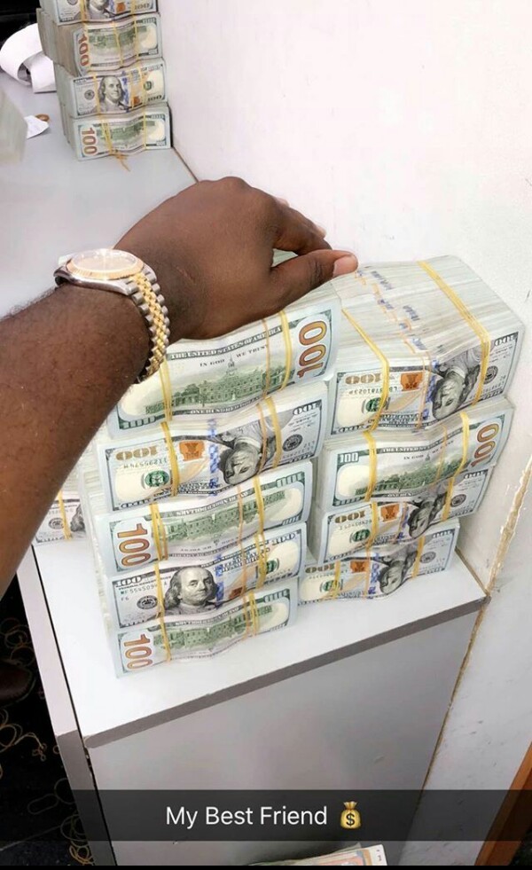 Flamboyant Nigerian man, Mompha shows off wads of dollars on Instagram, calls them his "best friend"