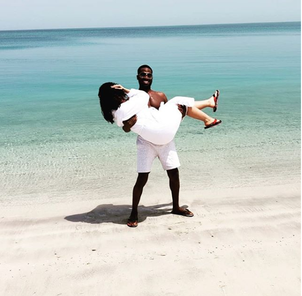 Loved-up photo of Dbanj carrying his wife at a beach in Dubai